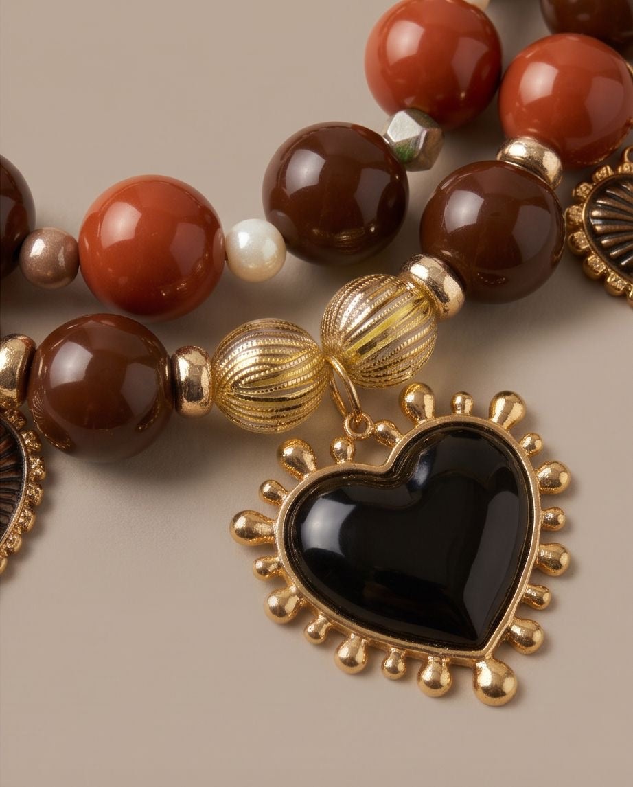 Dark Amour – Statement-Kette mit schwarzen Herzanhängern in Braun, Rostrot & Gold
